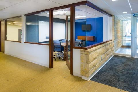 Picture of the study room equipped with rectangular table, 6 chairs, and a white board