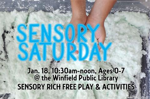 hands in a sensory bin 