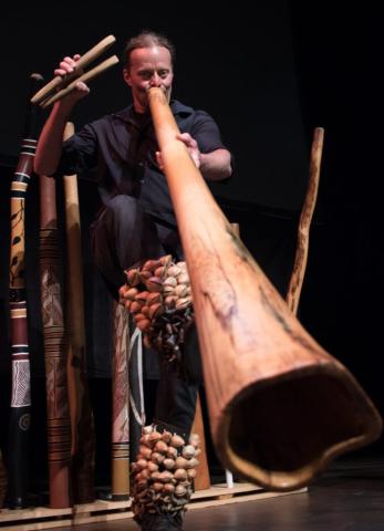 image of DDU's Rob Thomas playing a didgeridoo