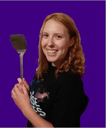 Image of Sabrina smiling and holding a spatula