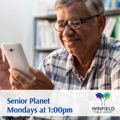 image of a man looking at a smart phone