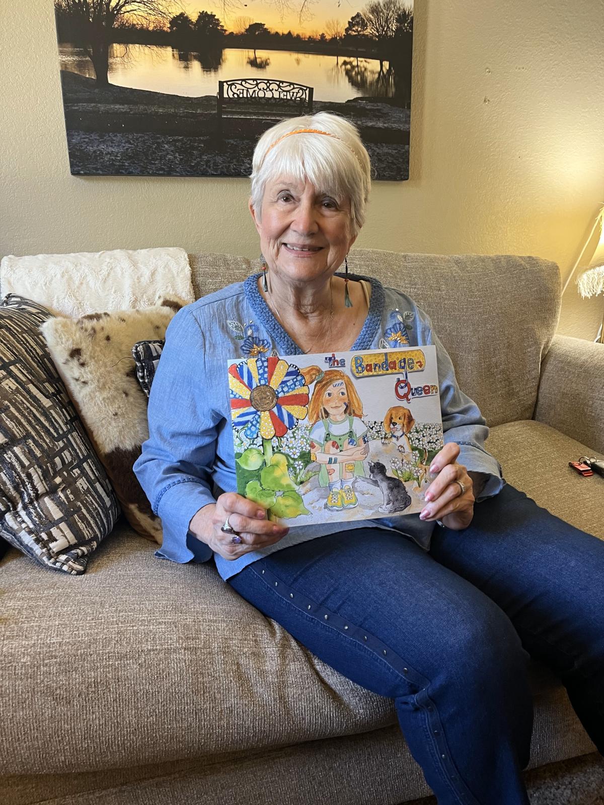 picture of local author Marsha Granberry holding her book, The Bandage Queen