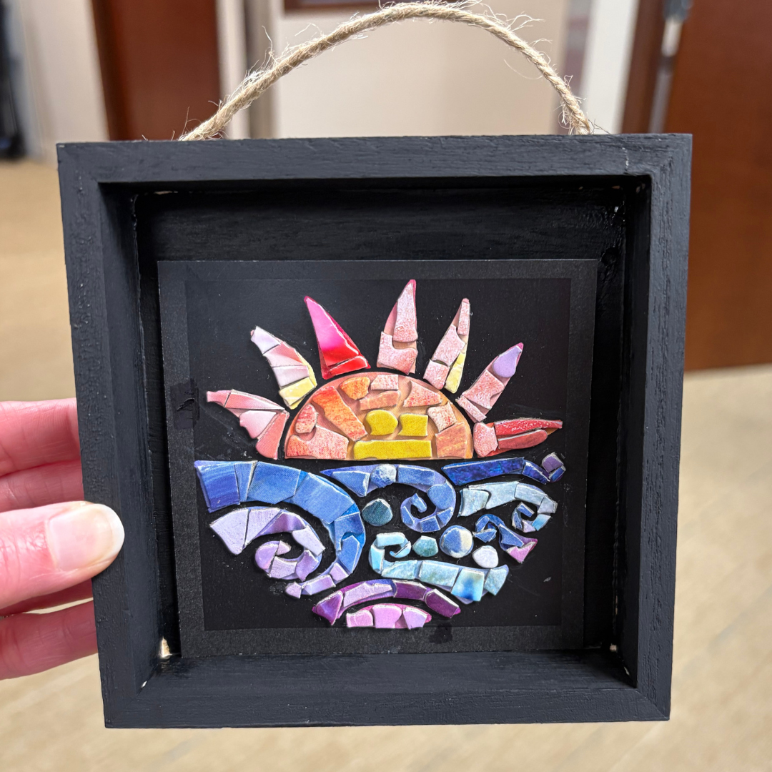 image of a sunrise overlaid with puzzle pieces set against a black background